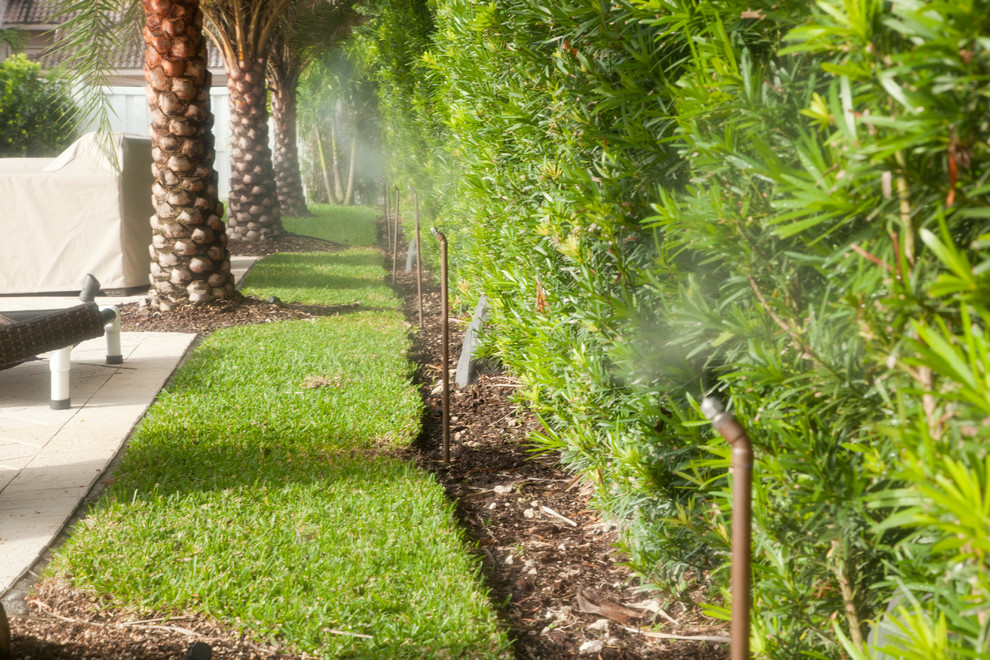 Inspiration for a huge tropical landscaping in Miami.