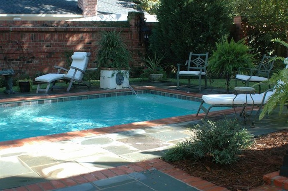 Pool fountain - mid-sized backyard stone and rectangular natural pool fountain idea
