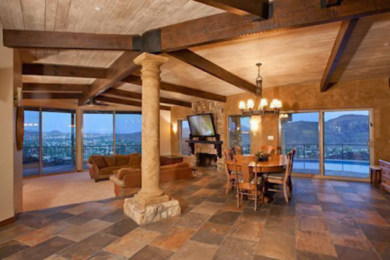 Transitional open concept ceramic tile home design photo in Phoenix with beige walls, a standard fireplace and a wall-mounted tv