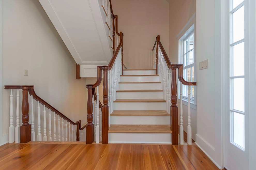 Staircase - mid-sized wooden u-shaped staircase idea in Burlington with painted risers