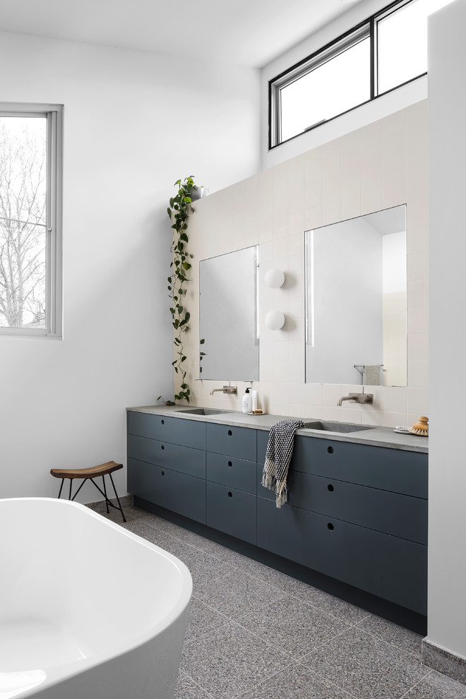 Inspiration for a large contemporary kids bathroom in Melbourne with a freestanding tub, an open shower, terrazzo floors, concrete benchtops, multi-coloured floor, an open shower and grey benchtops.