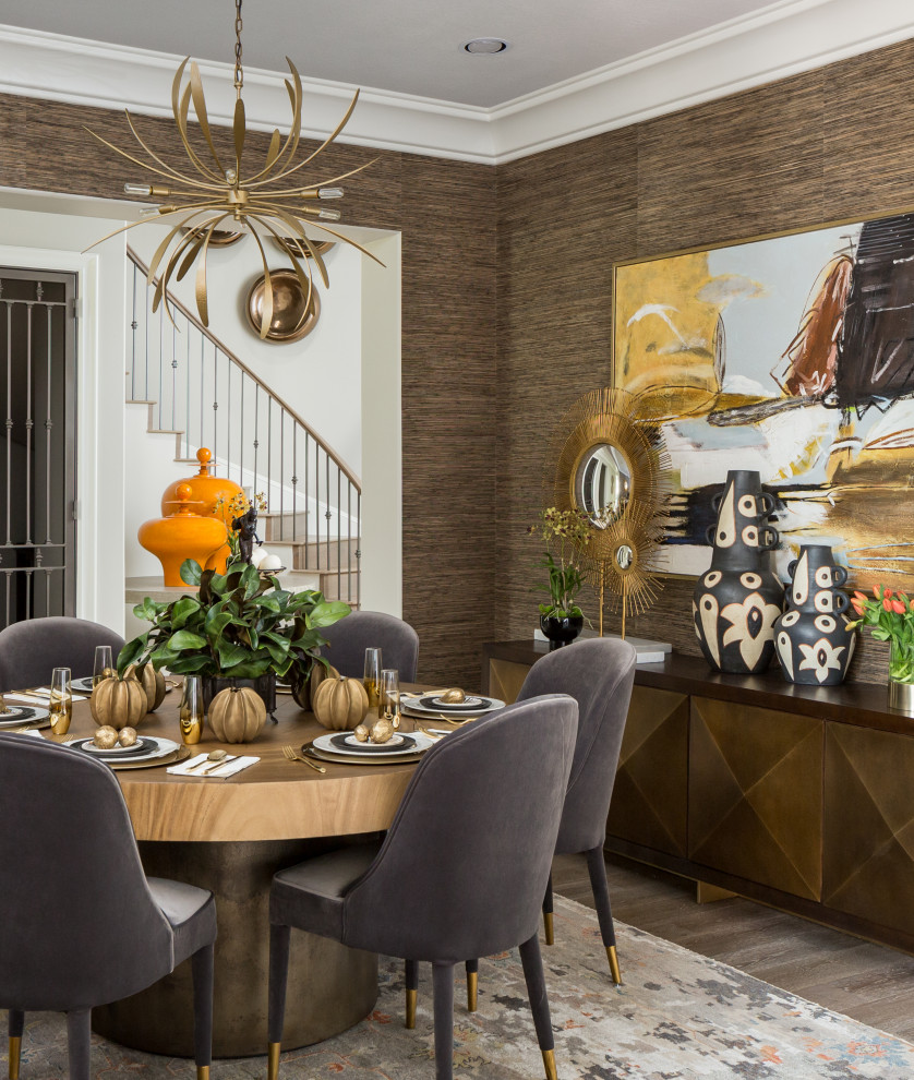 Expansive dining room in Houston with light hardwood flooring and wallpapered walls.