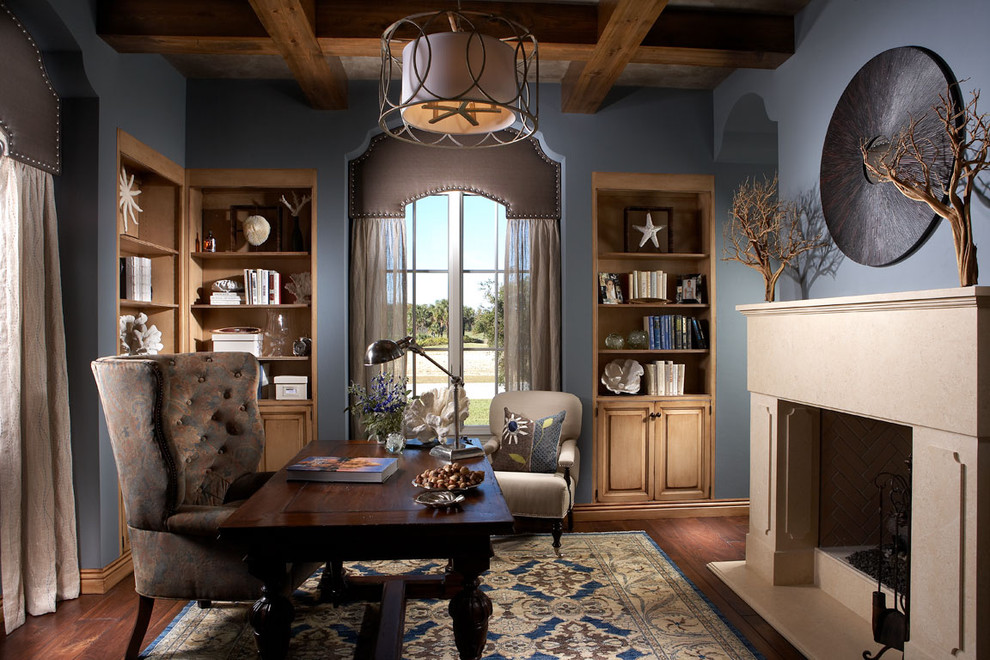 This is an example of a traditional home office in Other with blue walls.