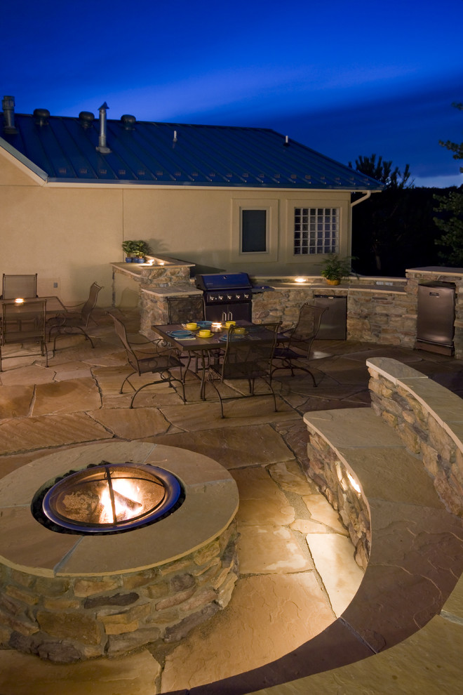 Inspiration for a large modern side yard patio in San Francisco with an outdoor kitchen, natural stone pavers and no cover.