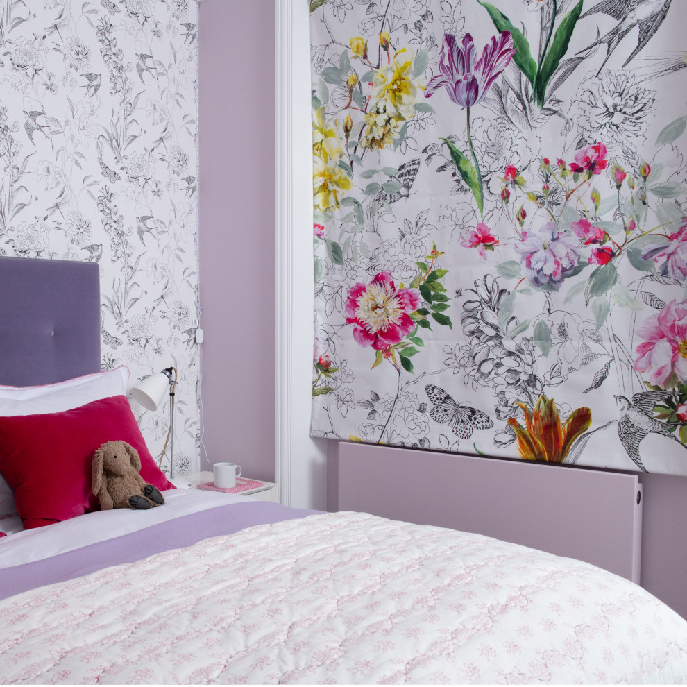 Photo of a mid-sized contemporary bedroom in London with purple walls, carpet, grey floor and wallpaper.