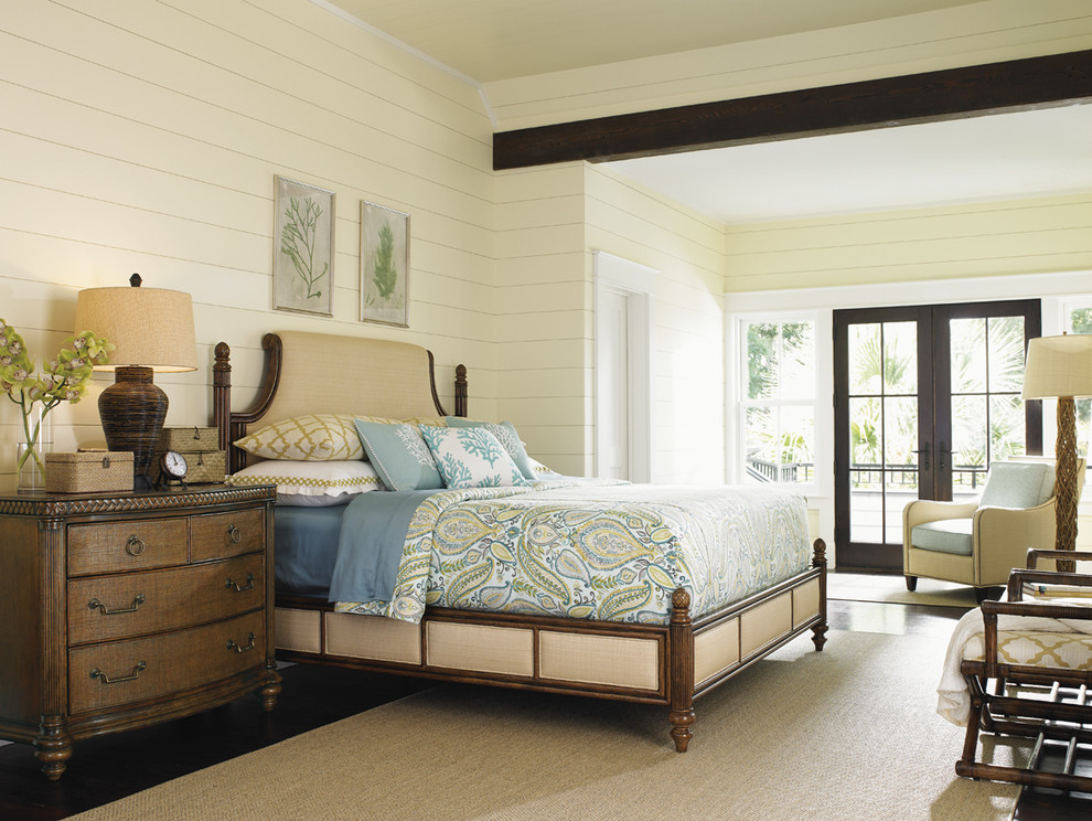 Design ideas for a large beach style master bedroom in Orange County with yellow walls and medium hardwood floors.