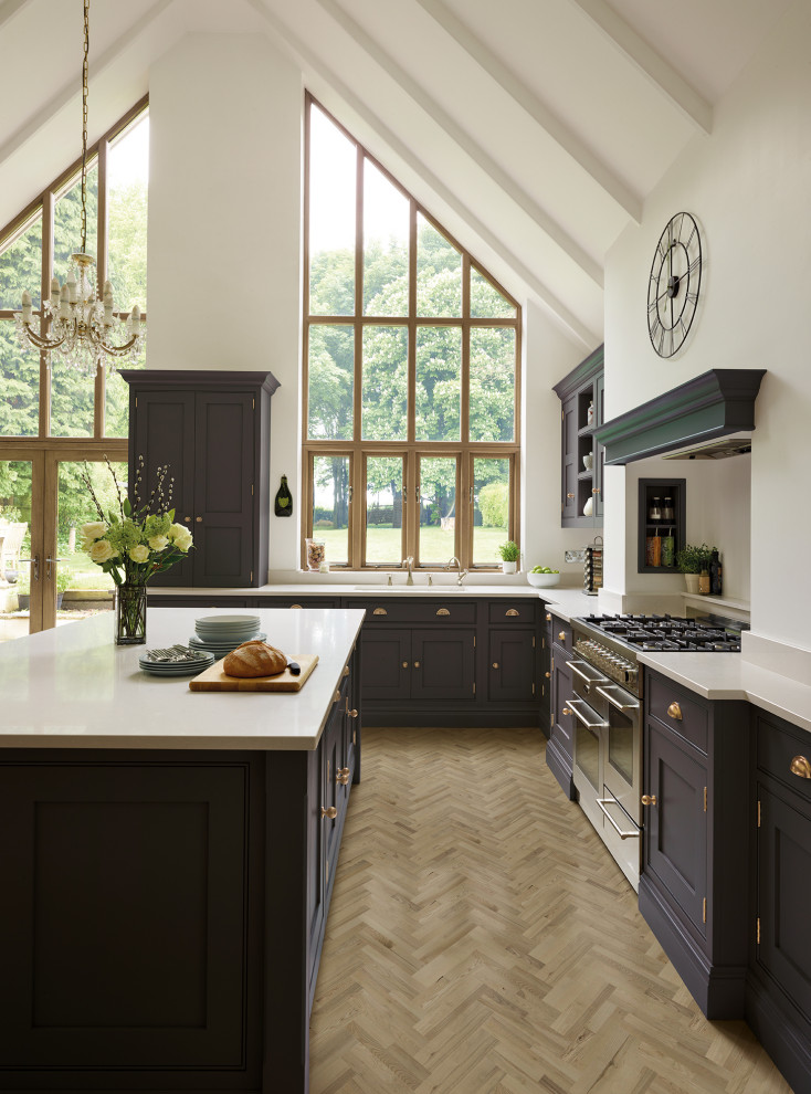 Photo of a large traditional l-shaped open plan kitchen in Other with shaker cabinets, purple cabinets, quartz worktops, stainless steel appliances, medium hardwood flooring, an island, brown floors and white worktops.
