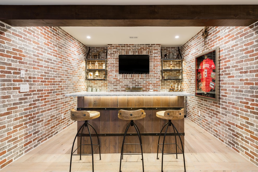 Example of a farmhouse home bar design in Atlanta