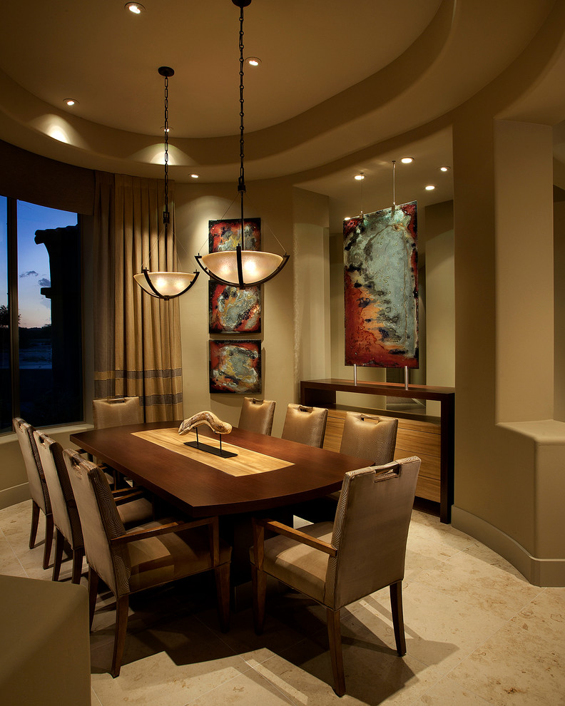 This is an example of a mid-sized contemporary separate dining room in Phoenix with beige walls and beige floor.
