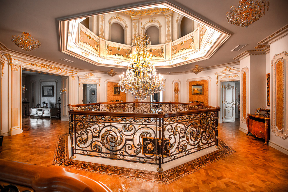 This is an example of a traditional hallway in Moscow with white walls, medium hardwood floors and brown floor.