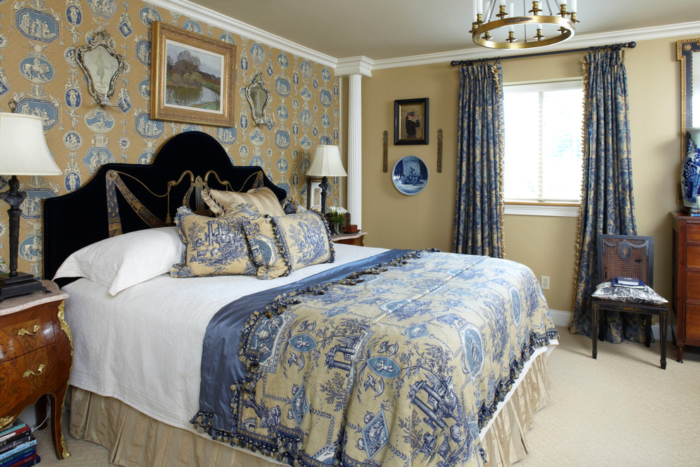 This is an example of a traditional bedroom with beige walls and carpet.