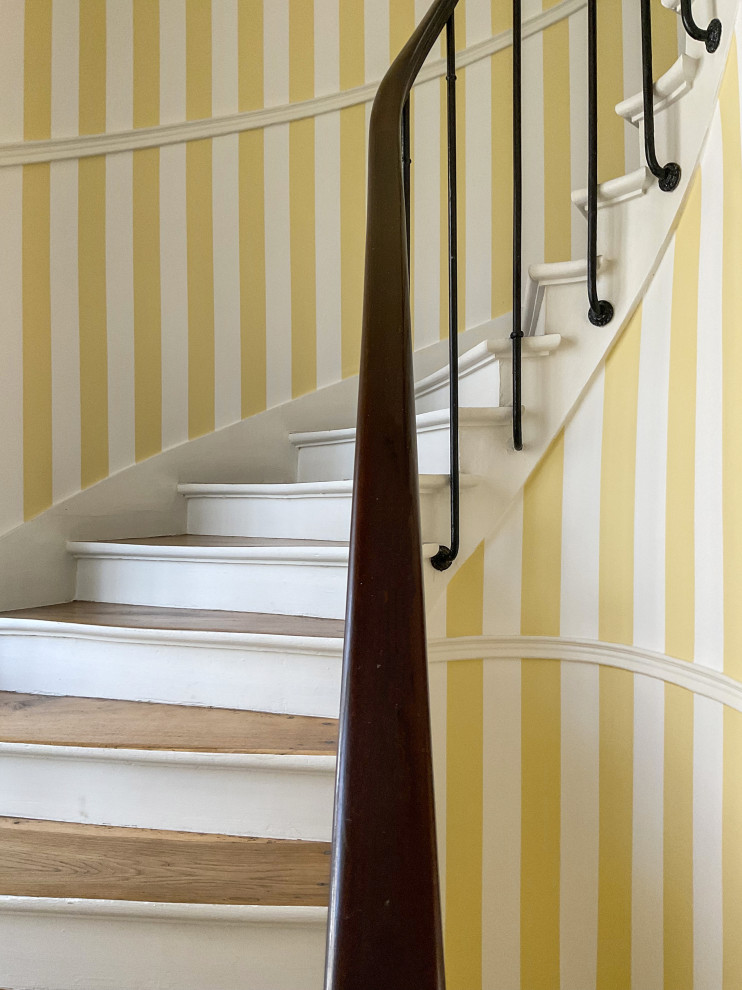 This is an example of a staircase in Paris with wallpaper.