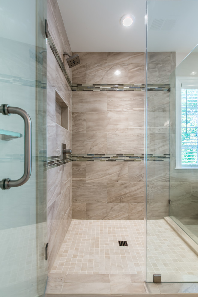 Design ideas for a large transitional master bathroom in DC Metro with recessed-panel cabinets, white cabinets, a freestanding tub, a corner shower, a two-piece toilet, beige tile, porcelain tile, beige walls, porcelain floors, an undermount sink, engineered quartz benchtops, beige floor and a hinged shower door.