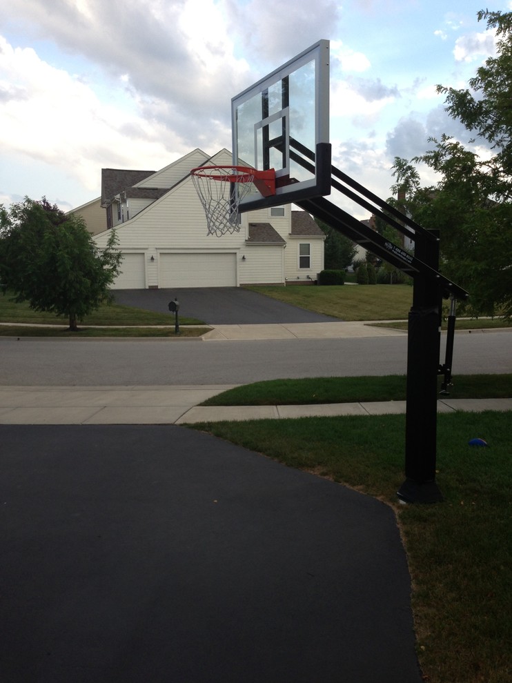 Photo of a large traditional front yard partial sun outdoor sport court in Columbus.