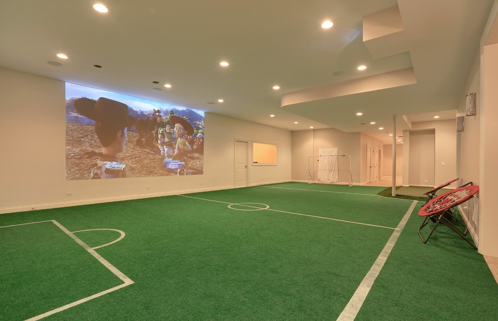 This is an example of a large traditional fully buried basement in Chicago with white walls and green floor.