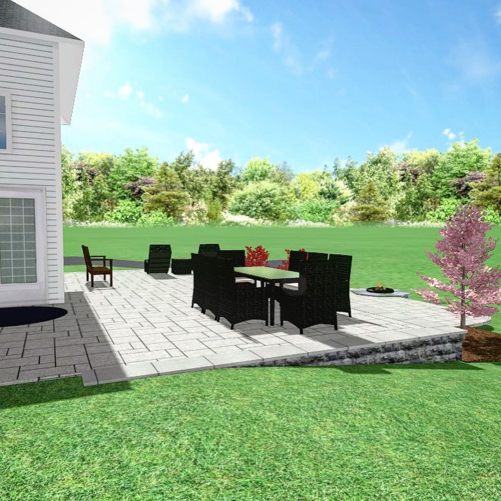 Design ideas for a mid-sized contemporary full sun backyard stone landscaping with a fire pit for spring.