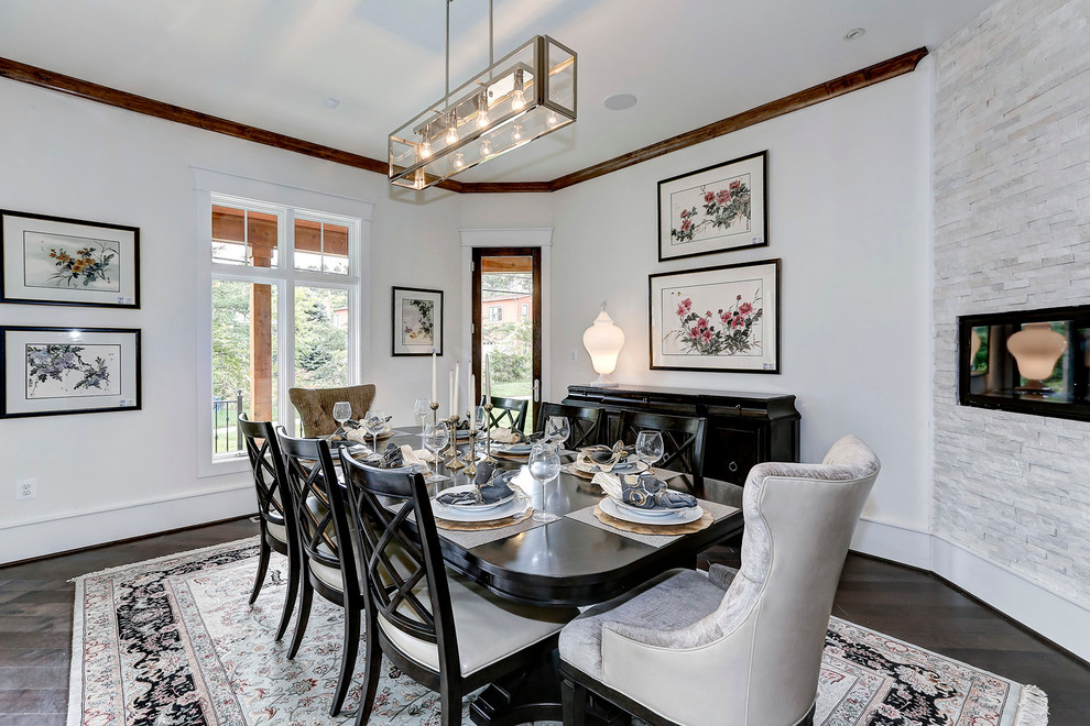 Mid-sized transitional open plan dining in DC Metro with white walls, dark hardwood floors, a ribbon fireplace and a stone fireplace surround.