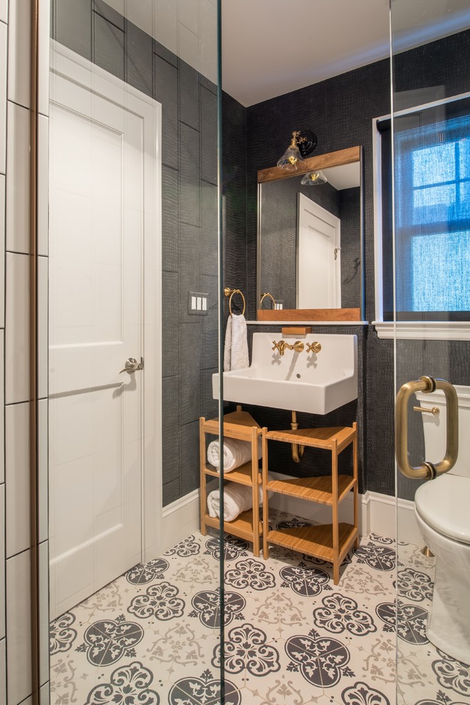 Inspiration for a mid-sized transitional 3/4 bathroom in Boston with open cabinets, light wood cabinets, an alcove shower, a one-piece toilet, white tile, porcelain tile, black walls, porcelain floors, a wall-mount sink, multi-coloured floor and a hinged shower door.
