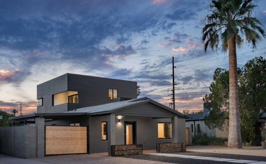 Inspiration for a mid-sized modern black two-story concrete fiberboard exterior home remodel in Phoenix with a mixed material roof