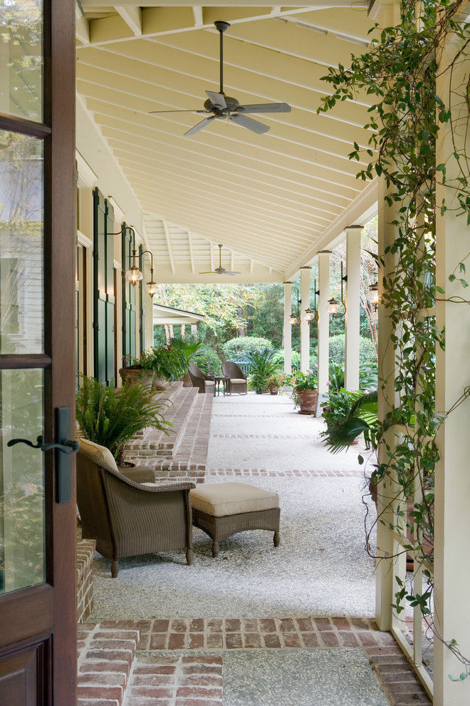 This is an example of a traditional verandah in Atlanta with a roof extension.