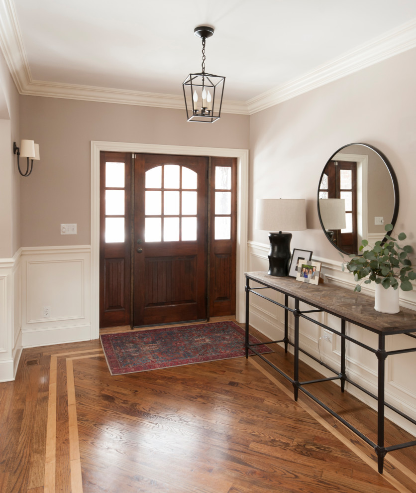 Single front door - transitional medium tone wood floor single front door idea in Chicago with beige walls and a dark wood front door