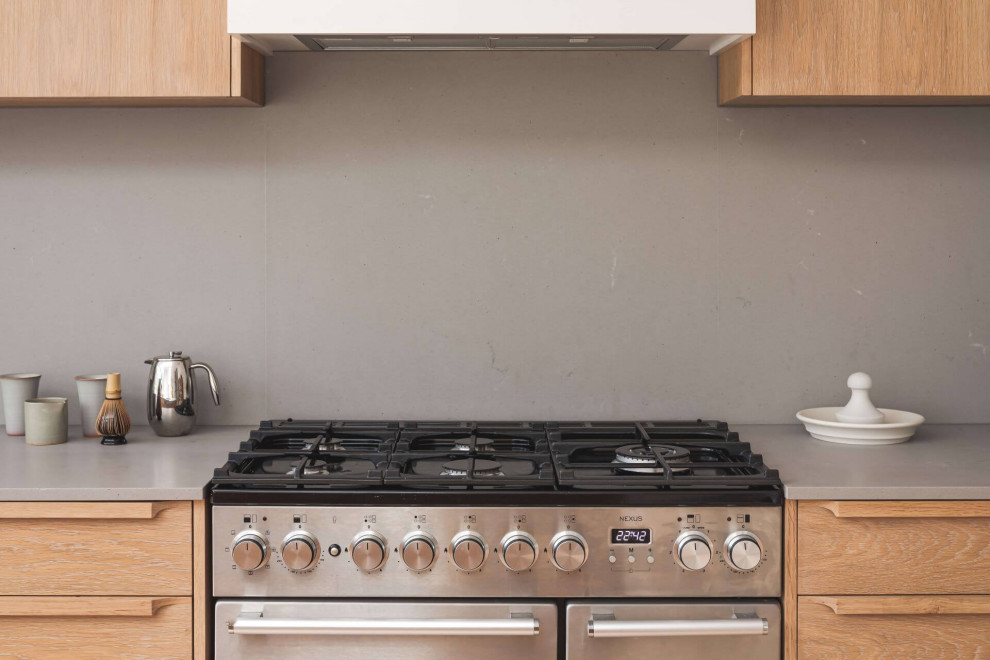 Large asian single-wall eat-in kitchen in Other with a single-bowl sink, flat-panel cabinets, medium wood cabinets, concrete benchtops, with island and white benchtop.