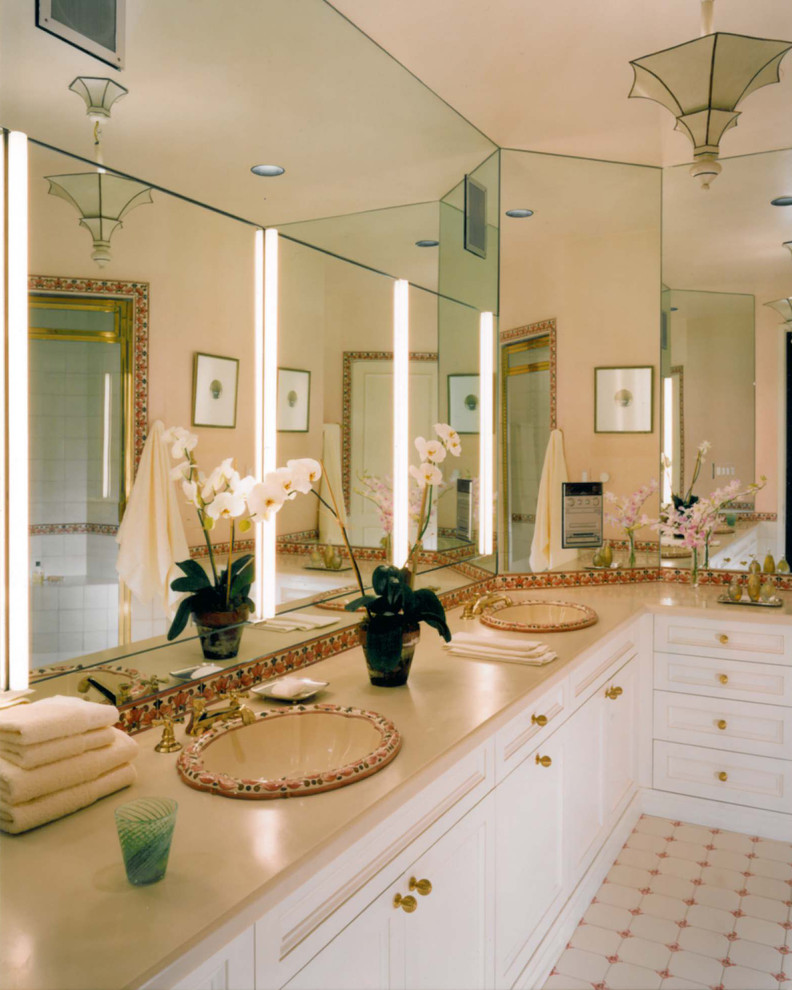 Inspiration for a mid-sized traditional master bathroom in New York with recessed-panel cabinets, white cabinets, an alcove shower, white tile, ceramic tile, beige walls, ceramic floors, a drop-in sink, laminate benchtops, white floor, a hinged shower door and beige benchtops.