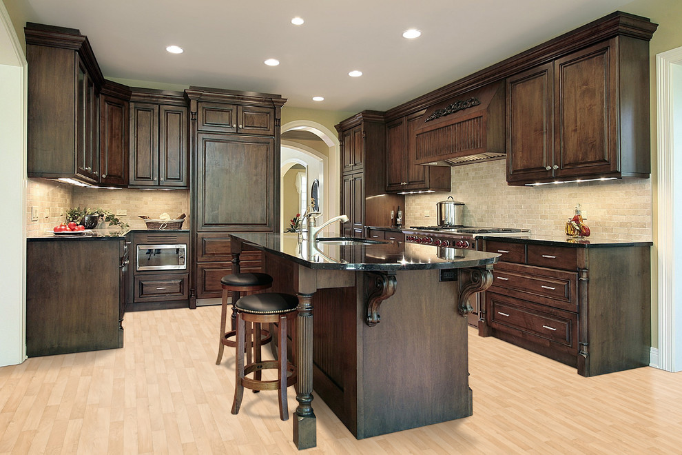 Transitional u-shaped vinyl floor kitchen photo in Miami with raised-panel cabinets, dark wood cabinets, beige backsplash, stone tile backsplash, paneled appliances and an island