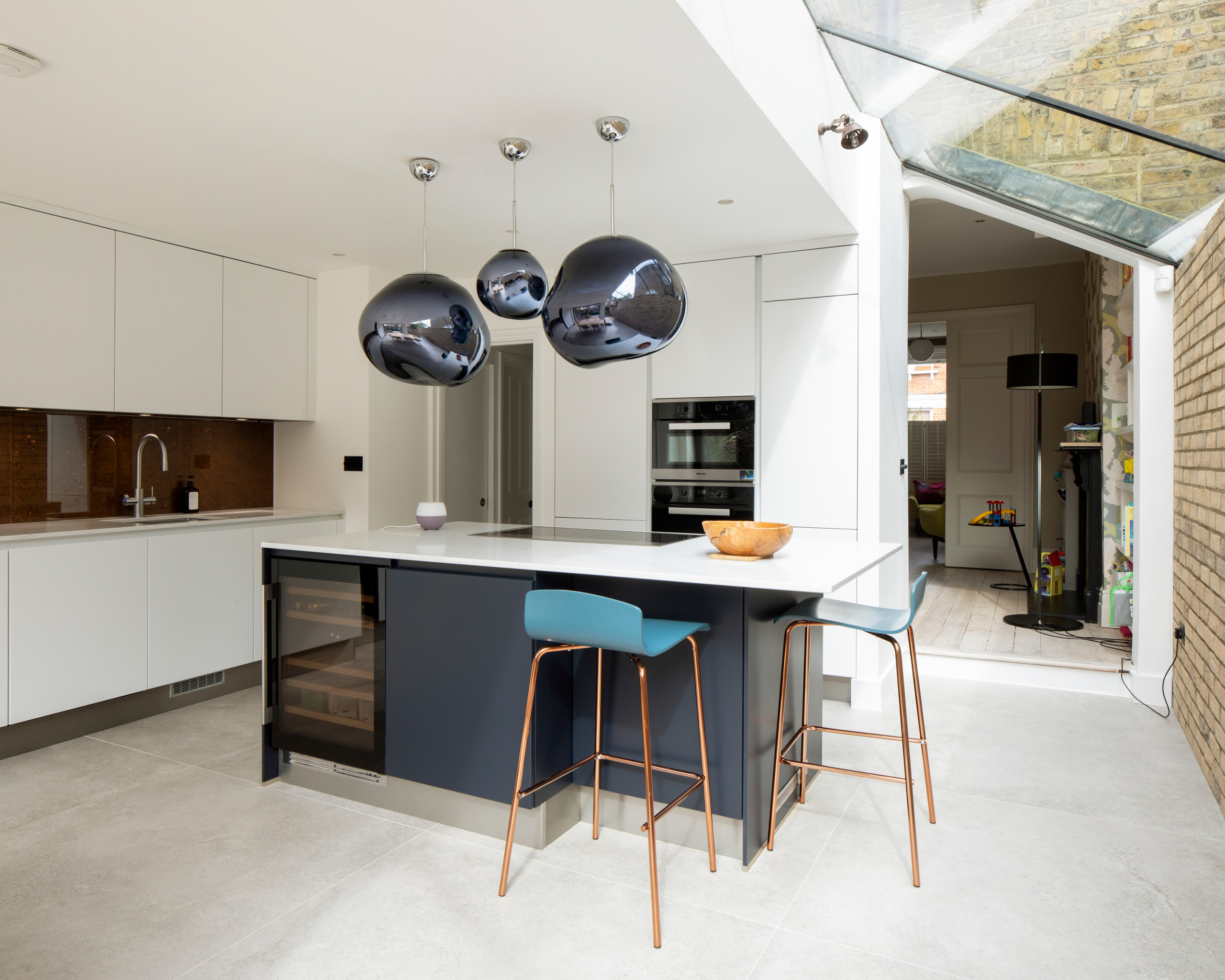 White Sleek Kitchen with Side Extension