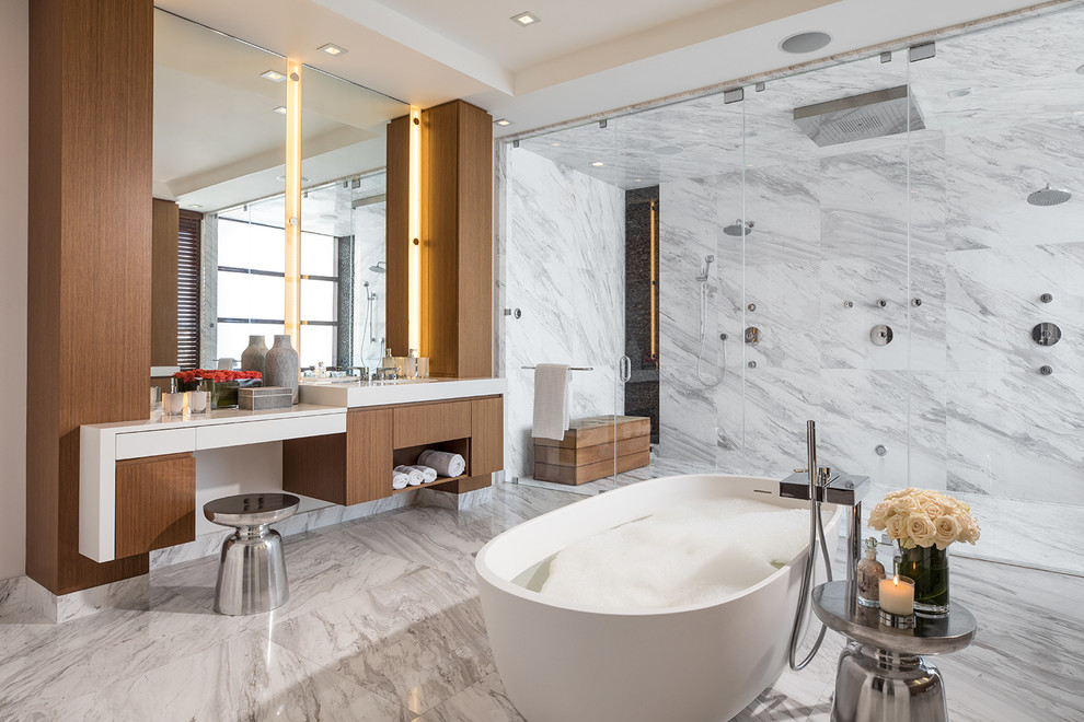 Inspiration for an expansive modern master bathroom in Miami with flat-panel cabinets, a freestanding tub, white tile, gray tile, multi-coloured tile, marble, marble floors, engineered quartz benchtops, white benchtops, dark wood cabinets, multi-coloured floor, a hinged shower door and a double shower.