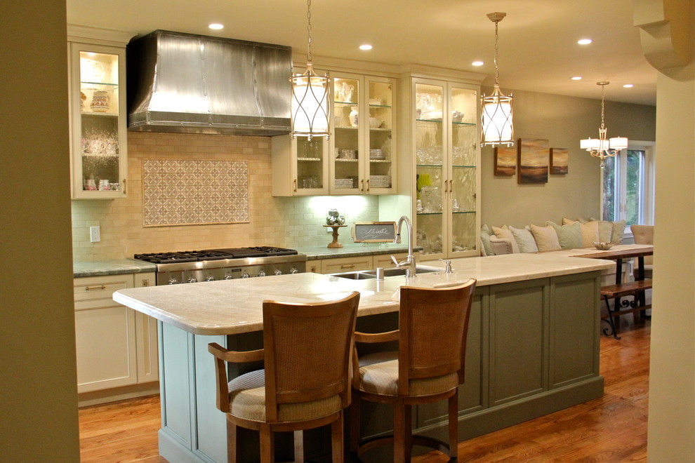 This is an example of a mediterranean eat-in kitchen in San Francisco with with island.