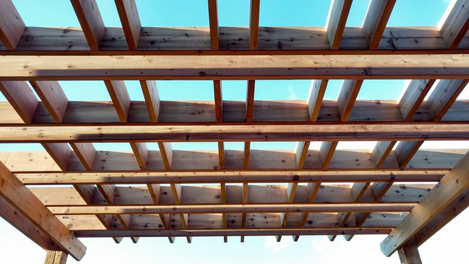 Inspiration for a large rustic deck remodel with a pergola