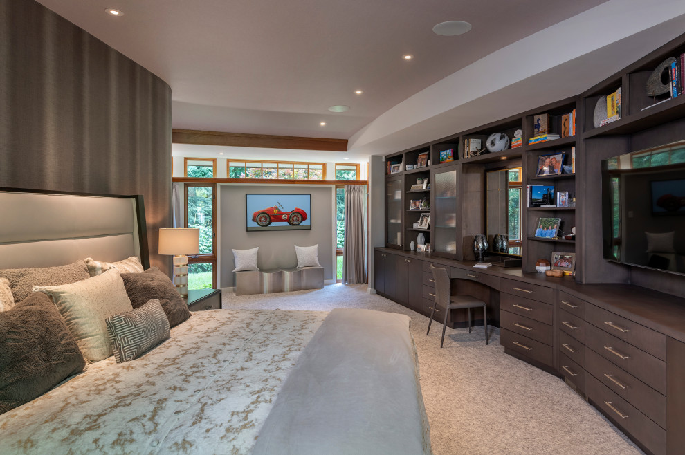 Expansive contemporary master bedroom in Boston with grey walls, carpet, grey floor and vaulted.