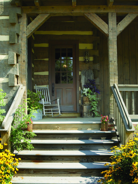 Mid-sized country front door in Charlotte with dark hardwood floors, a single front door and a brown front door.