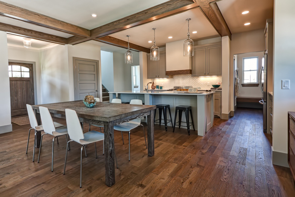 Design ideas for a traditional kitchen/dining combo in Minneapolis with white walls and dark hardwood floors.