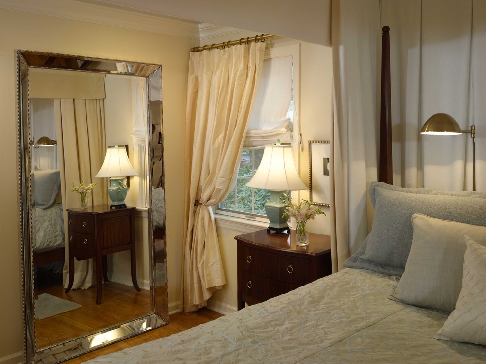 Traditional bedroom in Newark with beige walls and medium hardwood floors.