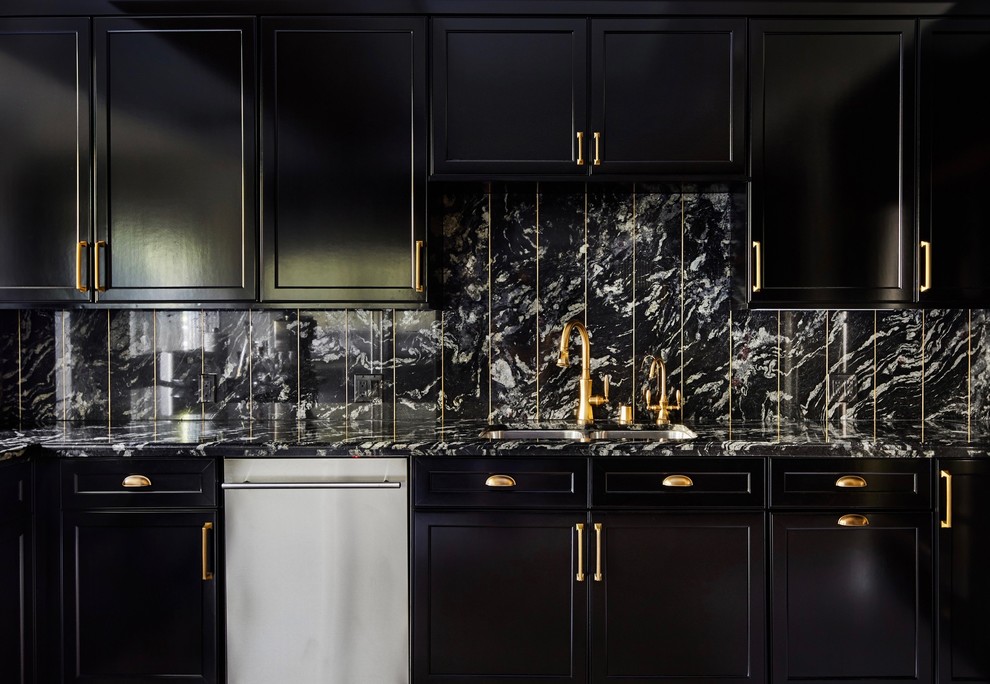 This is an example of a transitional kitchen in Los Angeles with beaded inset cabinets, black cabinets, marble benchtops, black splashback and black benchtop.