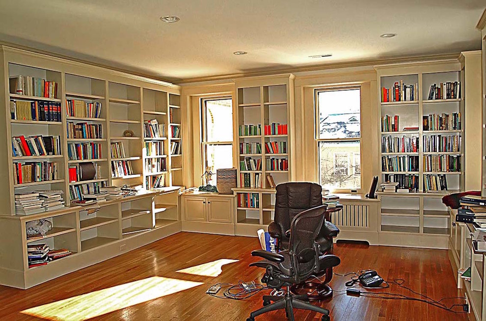 This is an example of a large traditional study room in Bridgeport with white walls and medium hardwood floors.