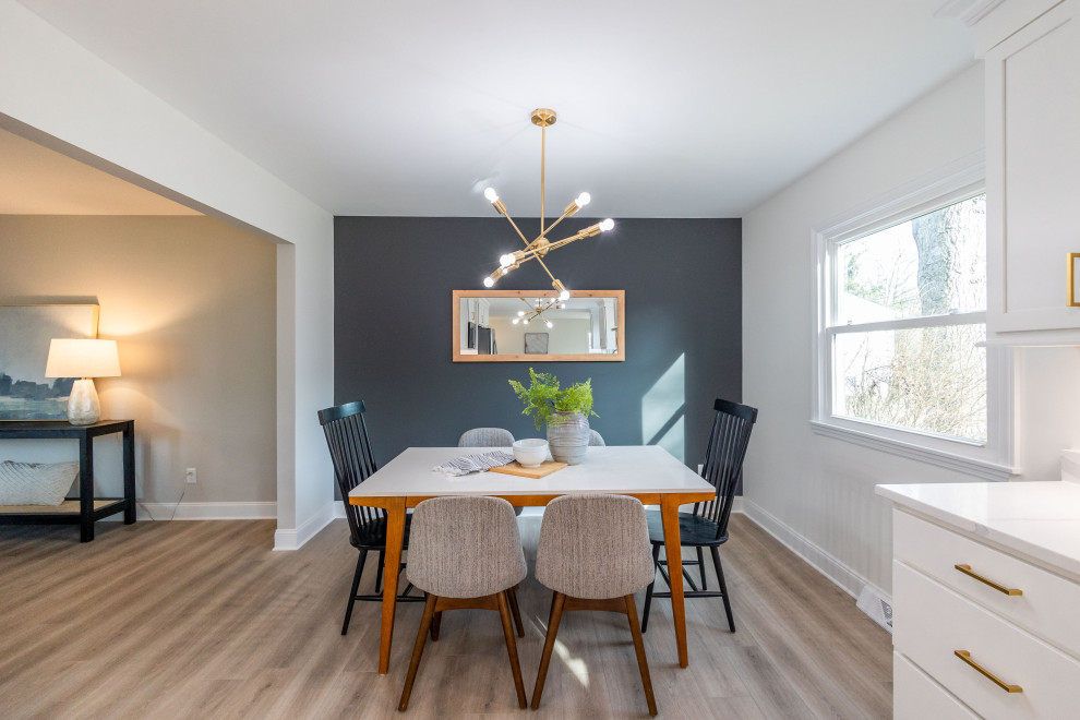Inspiration for a small vinyl floor and brown floor kitchen/dining room combo remodel in Columbus with gray walls