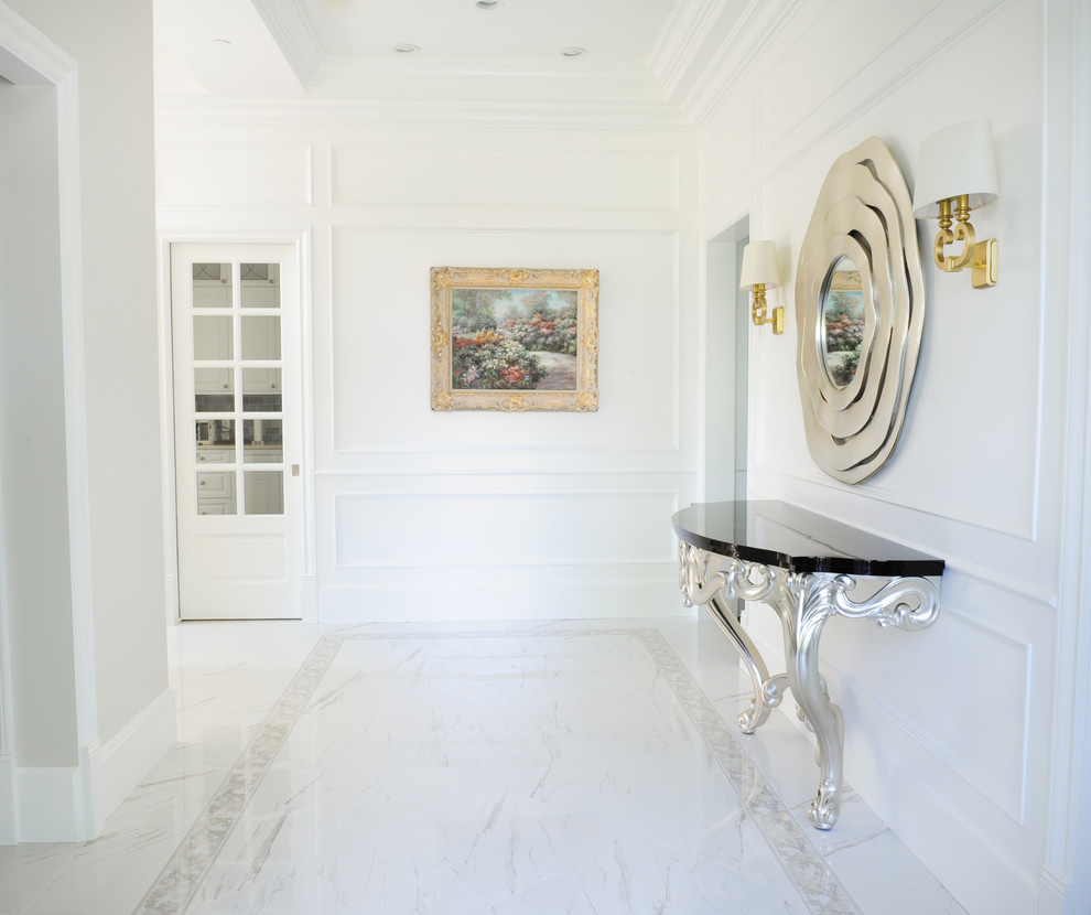 Inspiration for a mid-sized transitional marble floor foyer remodel in Vancouver with white walls and a black front door