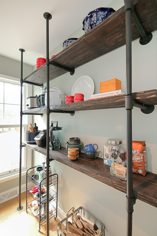 Inspiration for an industrial kitchen in Chicago with open cabinets, white splashback, subway tile splashback, stainless steel appliances, dark hardwood floors and multiple islands.