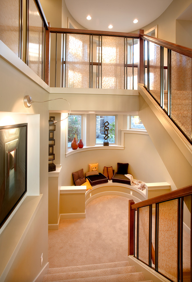 Photo of a contemporary carpeted staircase in Seattle with carpet risers.