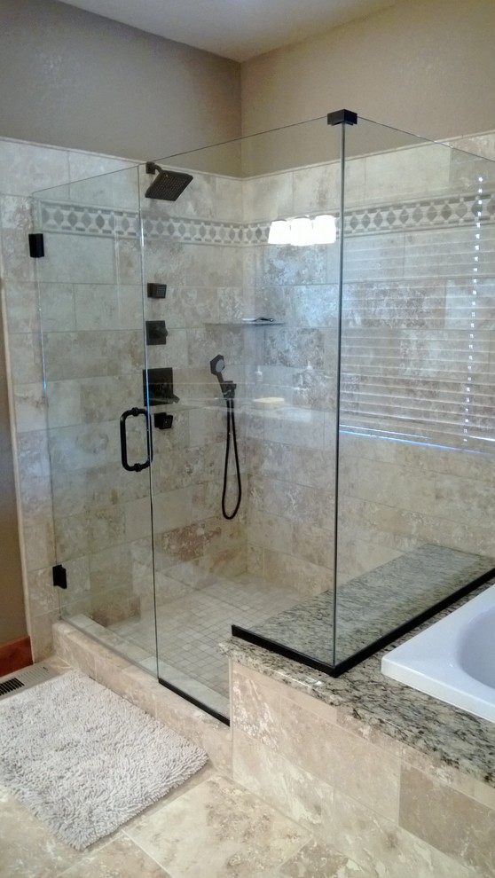 Mid-sized modern 3/4 bathroom in Denver with a drop-in tub, a shower/bathtub combo, gray tile, ceramic tile, beige walls and limestone floors.