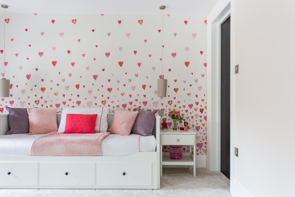 Design ideas for a mid-sized transitional kids' room for girls in Hertfordshire with carpet, grey floor and multi-coloured walls.
