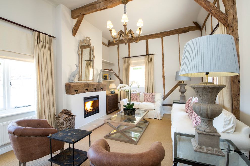 Country formal enclosed living room in Berkshire with white walls, carpet, a standard fireplace, a plastered fireplace surround, no tv, beige floors, exposed beams and a chimney breast.