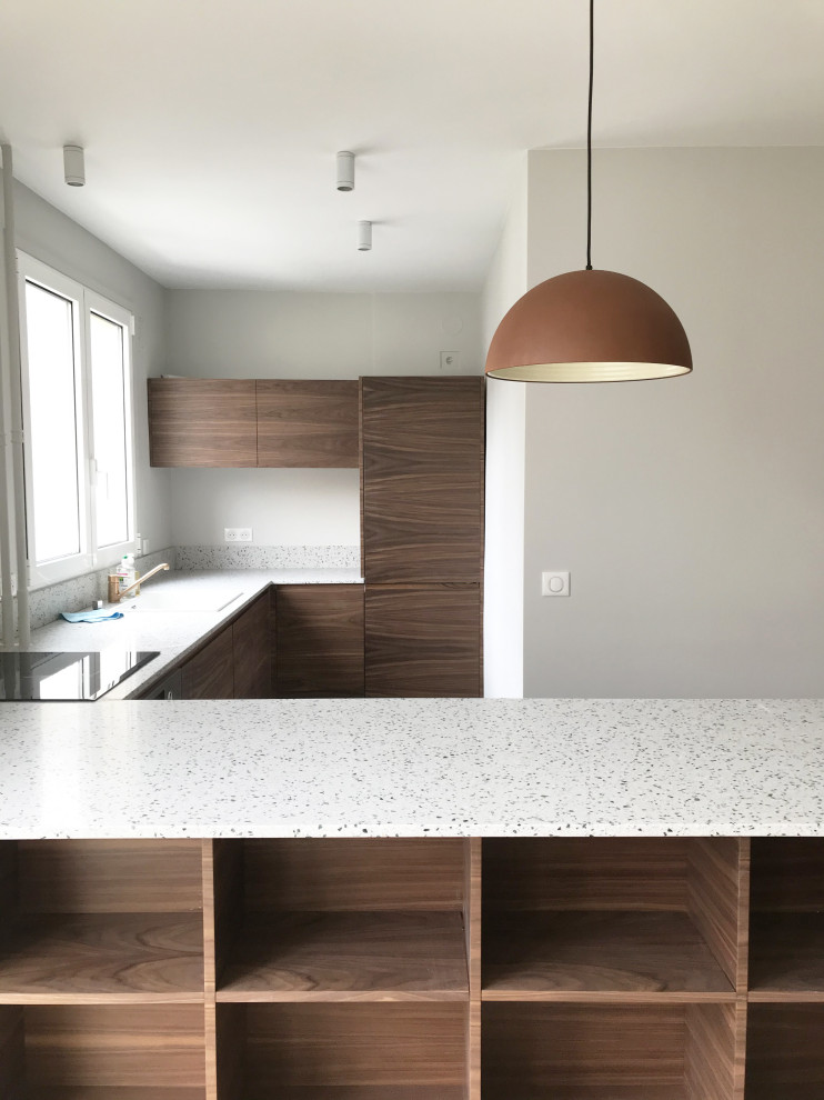Inspiration for a large contemporary u-shaped eat-in kitchen in Paris with medium wood cabinets, terrazzo benchtops, grey benchtop, green floor, a single-bowl sink and porcelain floors.