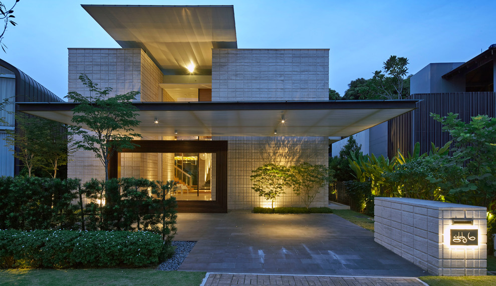 Design ideas for a contemporary exterior in Singapore with a flat roof.
