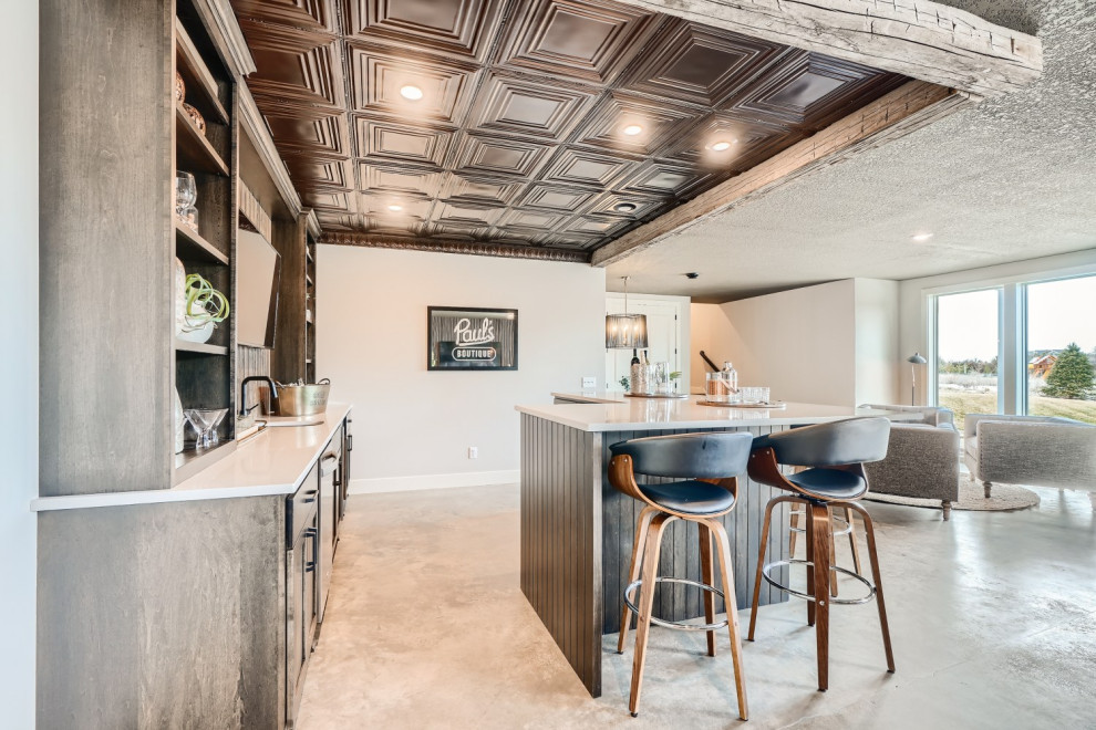 Large eclectic l-shaped wet bar in Minneapolis with an undermount sink, shaker cabinets, dark wood cabinets, quartz benchtops, brown splashback, concrete floors, grey floor and grey benchtop.