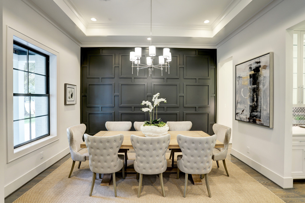 Photo of a transitional dining room in Houston.