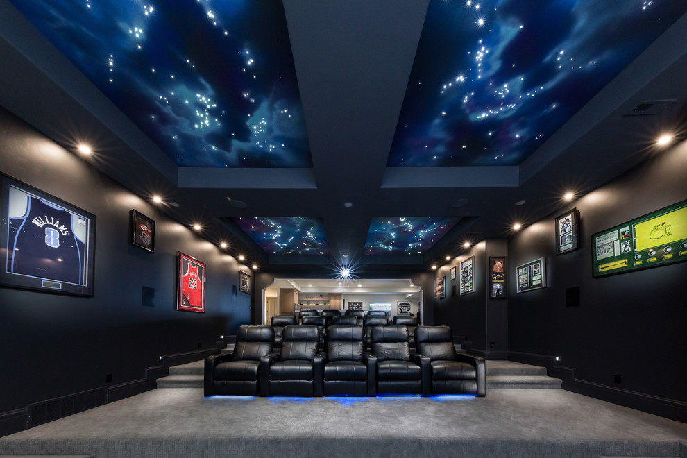 Large transitional open concept home theatre in Salt Lake City with grey walls, carpet, a projector screen and grey floor.
